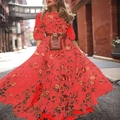 Red floral maxi dress with round neck and brown leather belt bag in a street style look - S / Red