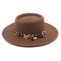 Detail of hand-woven straw hat crown with leopard print ribbon and side bow accent - M (56-58cm) / Brown