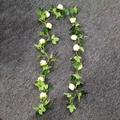 Detailed view of artificial white rose vine garland with eucalyptus leaves for wedding decor - 12 Rose Heads / 2.4m White Rose Vine