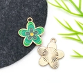 Macro detail of enamel flower charm showing colorful petals and golden metal texture - Drip Oil Green Four-Color Five-Petal Flower