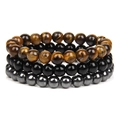 Close-up of triple-layered bead bracelet set featuring tiger eye and obsidian textures - 8mm Tiger Eye & Onyx & Hematite