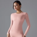 Close-up of pink long sleeve yoga top featuring slim fit design and stretch fabric - Light Pink (6662 Long Sleeve)