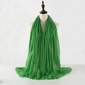 Solid green pleated cotton linen scarf with frayed edges displayed on a tailor mannequin - Green