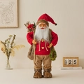 Bambola Babbo Natale in piedi con maglione rosso a trecce, sacco regalo e ghirlanda - 60CM