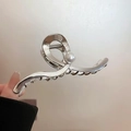 Silver metal butterfly hair claw clip with large pearl accent in a twisted design - Cross Pearl Style / Large / Silver