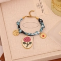 Vintage style blue print bracelet with rose cameo and sun coin charms, 17+5cm length - Blue & Black Patterned Scarf Pink Rose Bracelet (6#)