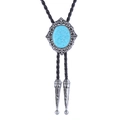 Western bolo tie featuring vintage silver floral base and oval turquoise stone detail - Lake Blue Turquoise
