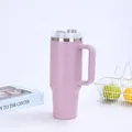Detail showing 40oz purple insulated tumbler with ergonomic handle and straw on white background - Pink (Generation 2)