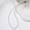 Classic white round pearl necklace with gold-tone clasp on a minimalist background - 3mm Round Bead Style