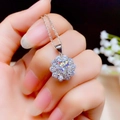 Macro view of flower-shaped pendant with round central stone on silver chain necklace - Xl-25 [with Chain]