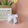 White organza drawstring gift bag with a satin bow and translucent mesh texture - 9*12cm / White
