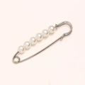 Macro shot of 7 white pearls on a gold metal waist pin for clothing adjustment - 6.5cm 5 Pearls Silver