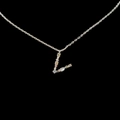 Silver letter L necklace with colorful zircons on a black background for women - Letter V / Silver