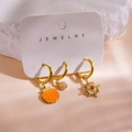 Detail view of 14K gold-plated earring set with enamel shell and stone charms on jewelry card - Shell Pink Stone Red Rhinestone Sun Style (Card M) / 3 Piece Set