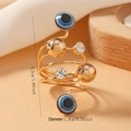 Spiral gold ring with blue evil eye beads and sparkling crystals with 1.8cm diameter - Spiral Evil Eye Gold