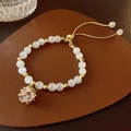 Adjustable gold plated bracelet with cat eye beads and crystal heart charm - Eco Gold Rhinestone Cat Eye