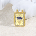 Detailed shot of UFO pendant with blue enamel and zircon inlay on a white texture - Blue UFO Style (ZYN-DMK878G-1)