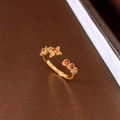 Macro shot of gold plated open ring with orange gemstone flowers and three round stones - 23# Gold Flower Open Ring - Red