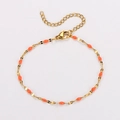 Bohemian gold chain bracelet with orange enamel charms and adjustable clasp closure - Gold + Orange Enamel
