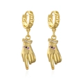 Close-up of gold plated hand drop earrings featuring purple evil eye and zircon stones - Gold/Purple Evil Eye