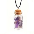 Detailed view of a mini glass bottle pendant filled with purple amethyst crystals and cork - Purple Crystal