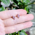 Close-up of pink marquise-cut crystal stud earrings with silver-tone double prong setting - Pink