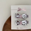 Detail of silver bow hair clips with pink ribbon and tiny rhinestones on a card - 6 Flat Knot Pair Clips