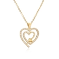 Élégant collier double cœur doré serti de zircons cubiques avec une fine chaîne croisée - Double cœur plein emboîté
