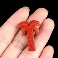 Red jasper coconut tree pendant held in hand for summer jewelry DIY projects - Red Jasper