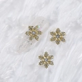 Golden snowflake nail art charm with crystal rhinestones on a glittery manicure - Style A1143-19