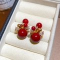 Macro detail of red cluster stud earrings with gold plating and clear zircons in a jewelry box - Gold Red (Gold Plated)