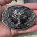 Macro detail of gunmetal wolf head belt buckle with integrated folding knife tool - Wolf Head