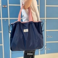 Foldable navy tote bag with pink handles and 42x54x11cm dimensions on blue background - XL Navy Blue