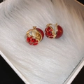 Detail of gold hoop earrings with red enamel hearts on white plush lining box - 58# Earring - Gold - Red