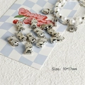 Silver cat and owl charms shown with a white pearl heart bracelet for DIY jewelry making - Style 06 Owl