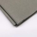 Detailed texture of folded grey tissue paper for craft and gift wrapping on white background - Gray