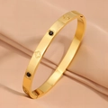 Gold-plated titanium clover bracelet featuring black enamel discs and a side clasp - Black Zirconia / Gold