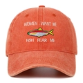 Close-up of fishing embroidery and vintage washed fabric on distressed baseball cap - Orange