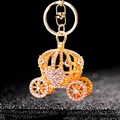 Golden pumpkin carriage keychain with sparkling crystals and metal clasp on black background - A523 Heart Pumpkin Carriage White