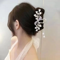 Detailed close-up of lily of the valley hair claw with pearls and rhinestone tassel - Bowknot Lily Of The Valley