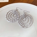 Macro shot of silver tiered circular drop earrings with hammered texture on ceramic - Silver Multi-layer Concentric Hammered Loop Earrings (30# Ear Hook)