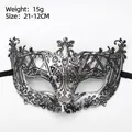 Silver vintage masquerade mask with intricate cutout patterns and black silk ties - Fox Silver