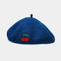 Close-up of navy blue wool beret featuring detailed red cherry embroidery and fine texture - One Size / Cyan Blue