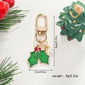 Christmas keychain dimensions showing height 6cm and width 2cm with festive decoration - Christmas Holly Leaves