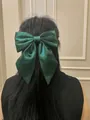 Dark green satin bow hair clip with streamers shown on long black hair for women - Spring Clips / Dark Green