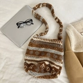 Close-up of a large brown plush tote bag made of soft faux fur on a white bed - Brown Geometric