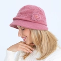 Detail of pink knitted hat with 3D flower decoration and warm mohair texture - Pink