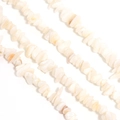 Macro view of irregular natural shell stone beads for DIY jewelry making on white base - 8*5mm (Approx. 220 Pcs) / Snow White Shell Chips
