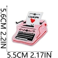 Detail of pink typewriter embroidery patch with 'I love you' text and red heart - Vintage Typewriter