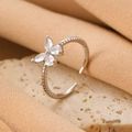 Silver bow ring with pear-cut cubic zirconia in a twisted open band design - Silver Butterfly Twist Ring (WG-0597)